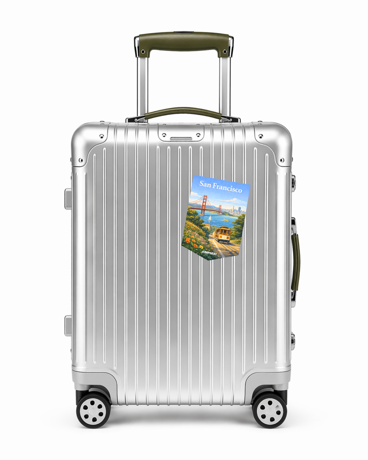 Silberner Reisekoffer mit San Francisco Reise-Sticker und grünem Griff